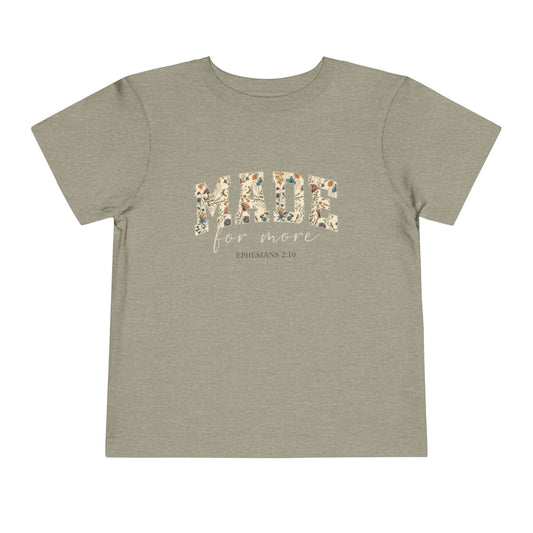 Pink t-shirt with floral text design 'made for more' with text Ephesians 2:10