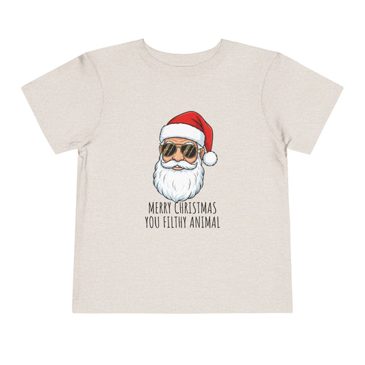 Child wearing a t-shirt with a graphic of Santa Claus and text on a plain background