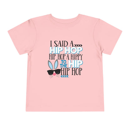 Pink t-shirt with text and graphic design on a white background