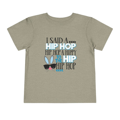 Children's t-shirt with humorous text design on a beige background