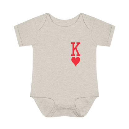 Beige baby onesie with a red 'K' and heart design on a white background