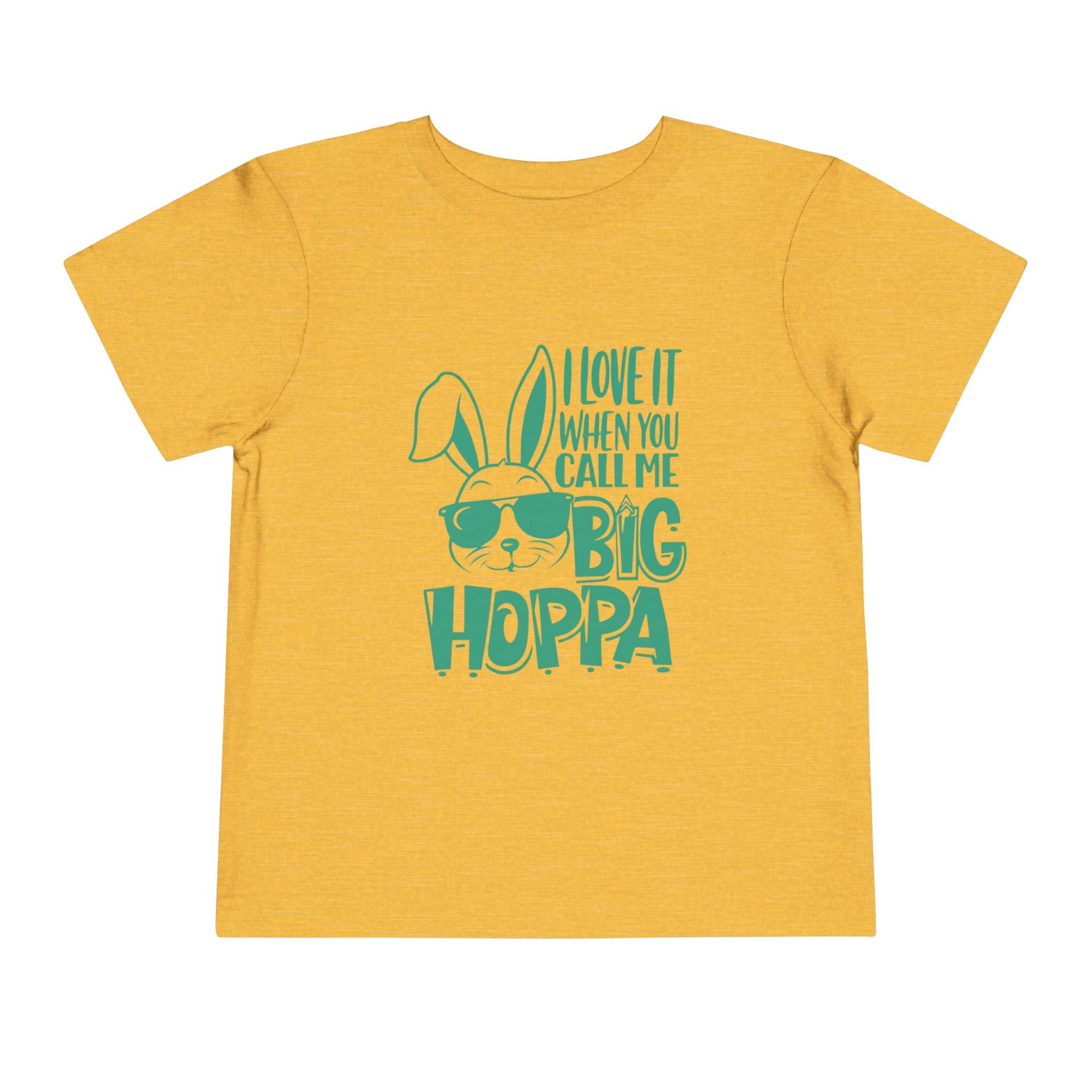 Yellow t-shirt with green text and graphic on a white background