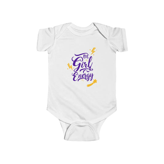 Baby wearing a 'Girl Energy' onesie sitting on a pink textured surface with a colorful heart-patterned background.