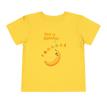 Yellow t-shirt with a banana graphic and text on a white background