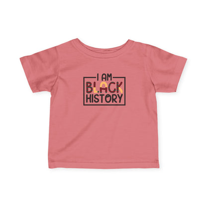 Pink t-shirt with 'I AM BLACK HISTORY' text on a white background