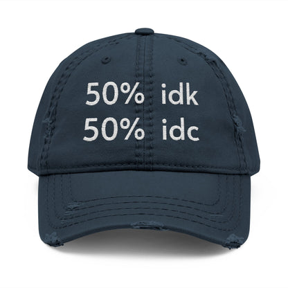 Navy blue cap with white text '50% idk 50% idc' on a white background
