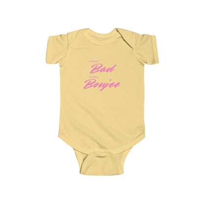 Yellow baby onesie with pink text on a white background