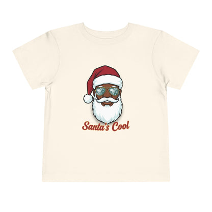 Beige t-shirt with a graphic of a Santa Claus face wearing sunglasses and the text 'Santa's Cool' on a white background.