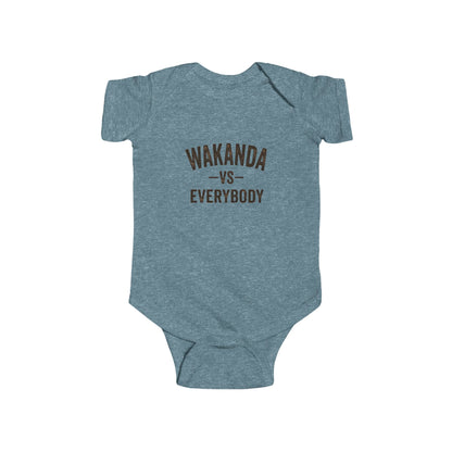 Gray baby onesie with text 'Pass me to Granda' on a white background