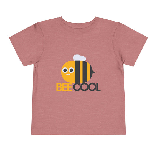 Pink t-shirt with a bee graphic and 'BEE COOL' text on a white background