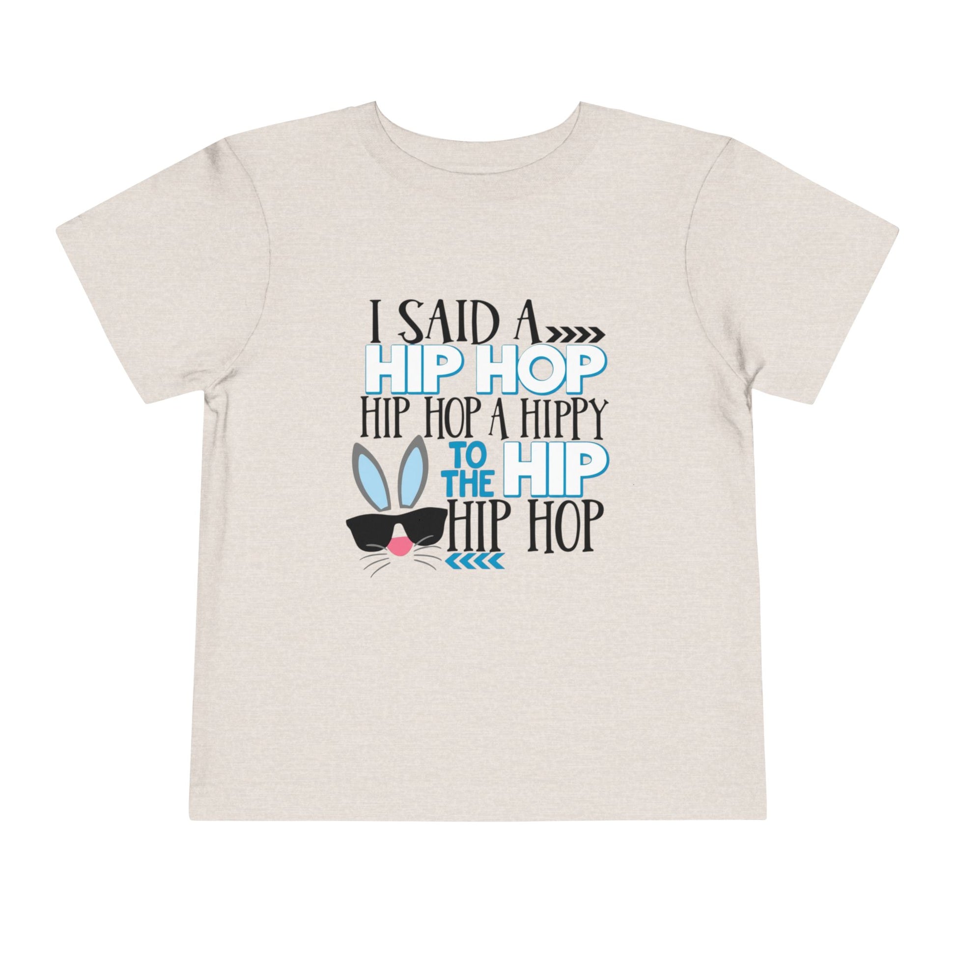 Beige t-shirt with colorful text and graphic on a white background