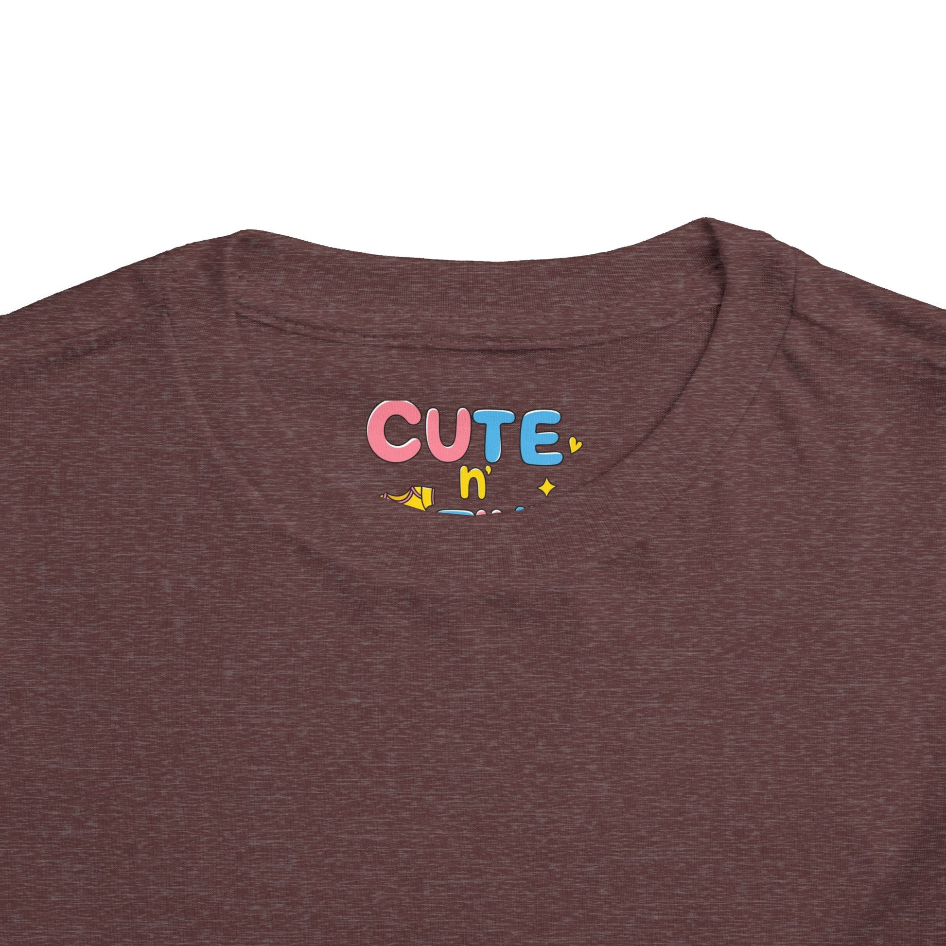 Brown t-shirt with 'CUTE n' text in colorful letters on a white background