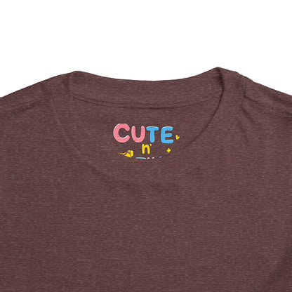 Brown t-shirt with 'CUTE n' text in colorful letters on a white background