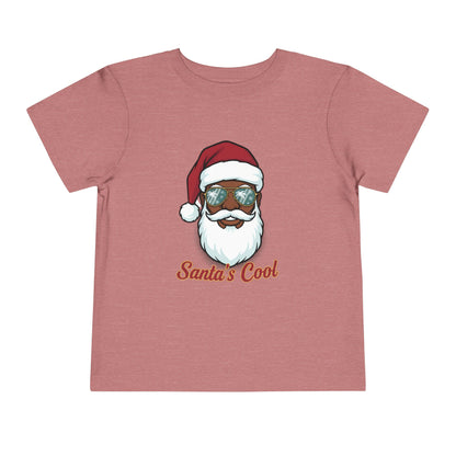 Pink t-shirt with a graphic of a Santa Claus face wearing sunglasses and the text 'Santa's Cool' on a white background.