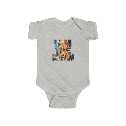 Gray baby onesie with 'I AM THE DREAM' text on a white background