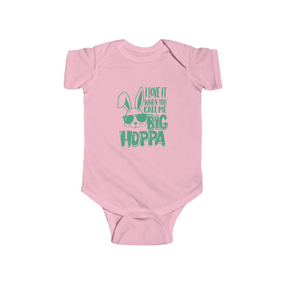 Pink baby onesie with green "big Hoppa" text and bunny graphic on a white background