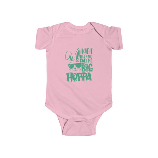 Baby wearing a gray t-shirt with green "Big Hoppa" text on a white background