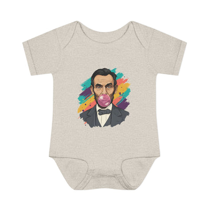 Beige baby onesie with a colorful graphic of a historical figure on a white background