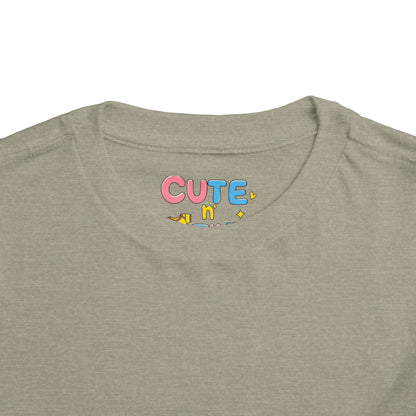 Collar of a green shirt with 'CUTE n' text in colorful letters.
