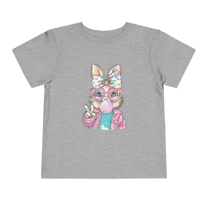 Gray t-shirt with a colorful graphic of a bunny wearing glasses and a bow on a white background