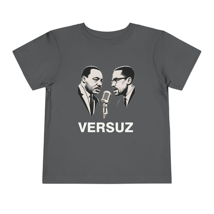 Gray t-shirt with graphic of two men and a microphone, labeled 'VERSUZ', on a white background.