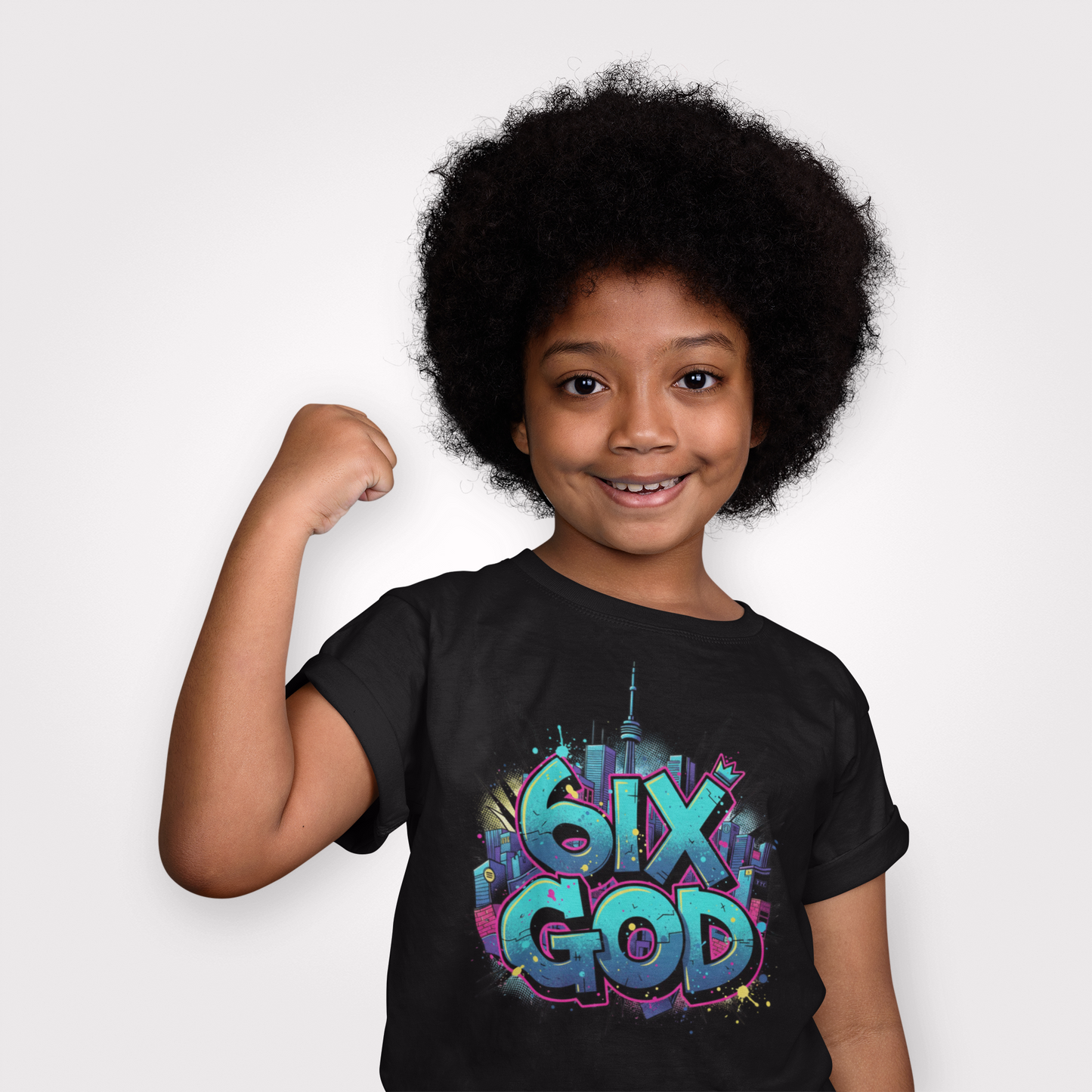 Child wearing a black t-shirt with colorful text, flexing their arm on a white background