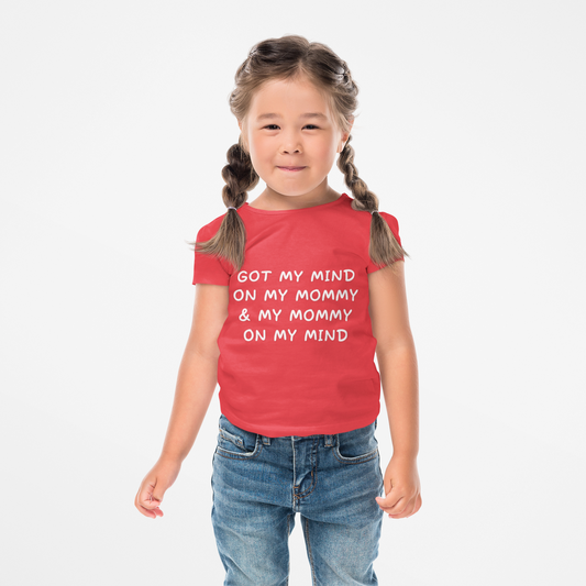 Child wearing a red t-shirt with text on a white background