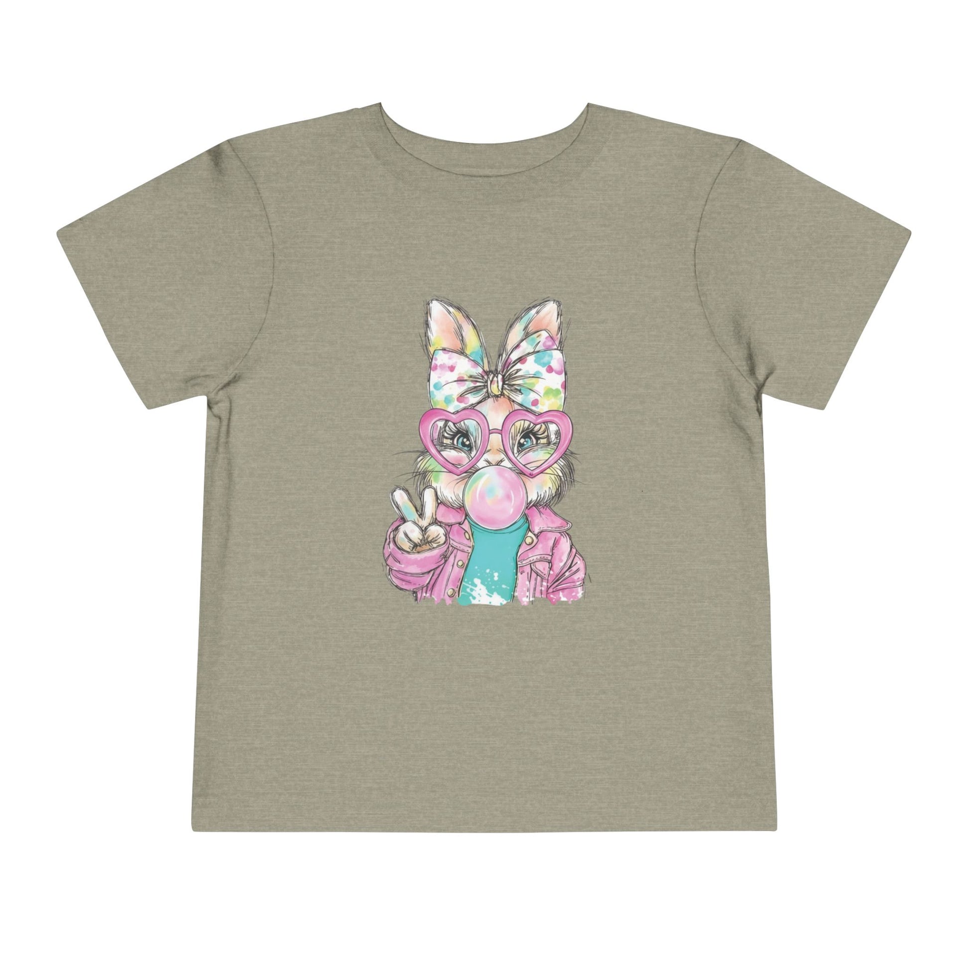 Children's t-shirt with a cartoon character wearing a colorful bow and glasses on a beige background