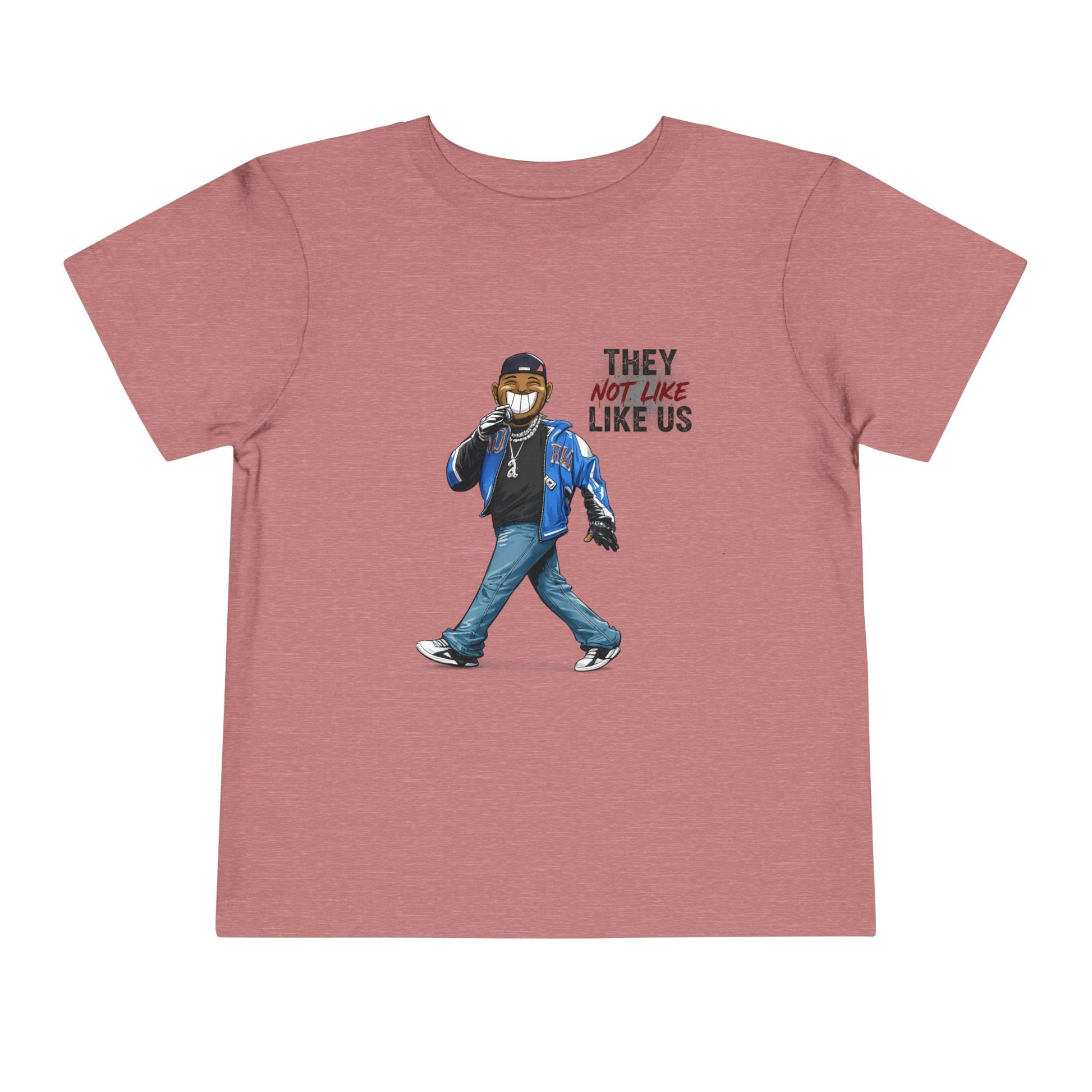 Pink t-shirt with graphic of a person wearing a mask and text 'THEY LIKE NOT US LIKE US' on a white background
