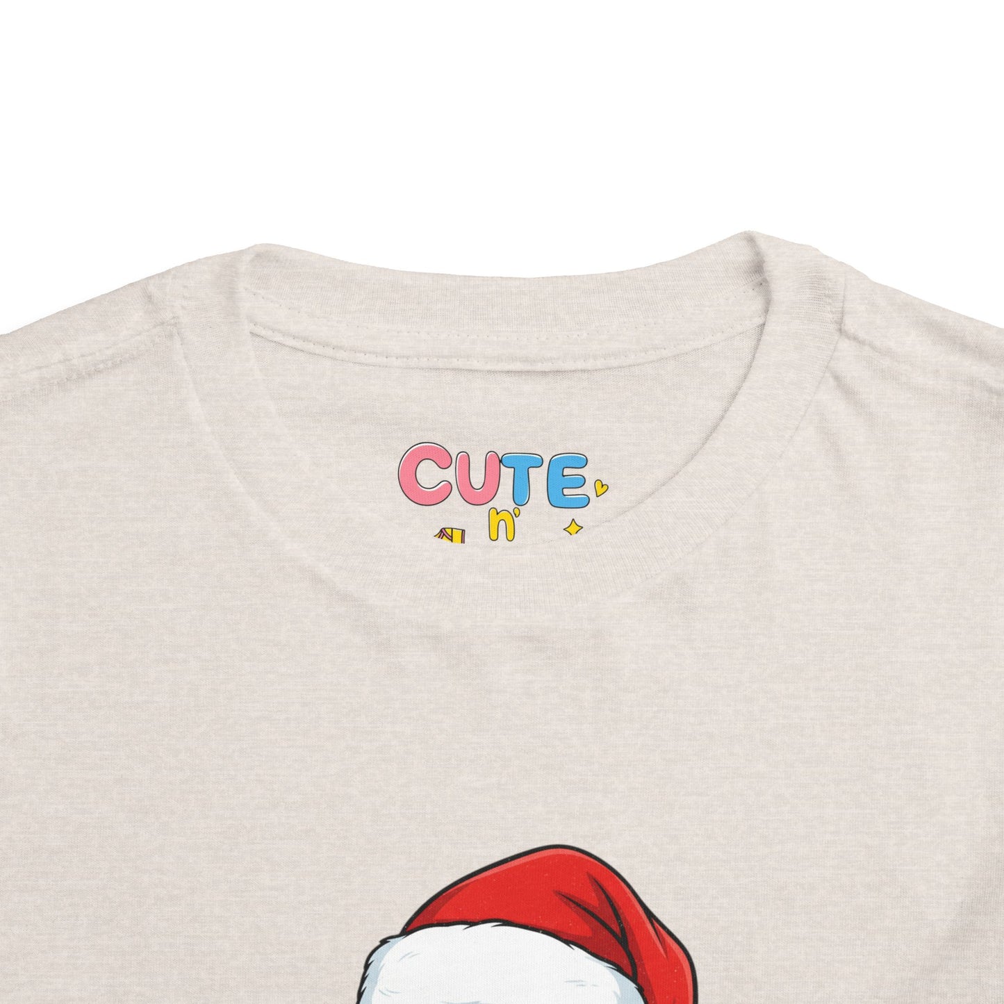 Beige t-shirt with colorful 'CUTE' text and red Santa hat graphic.