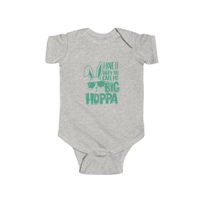 Gray baby onesie with green text and graphic on a white background