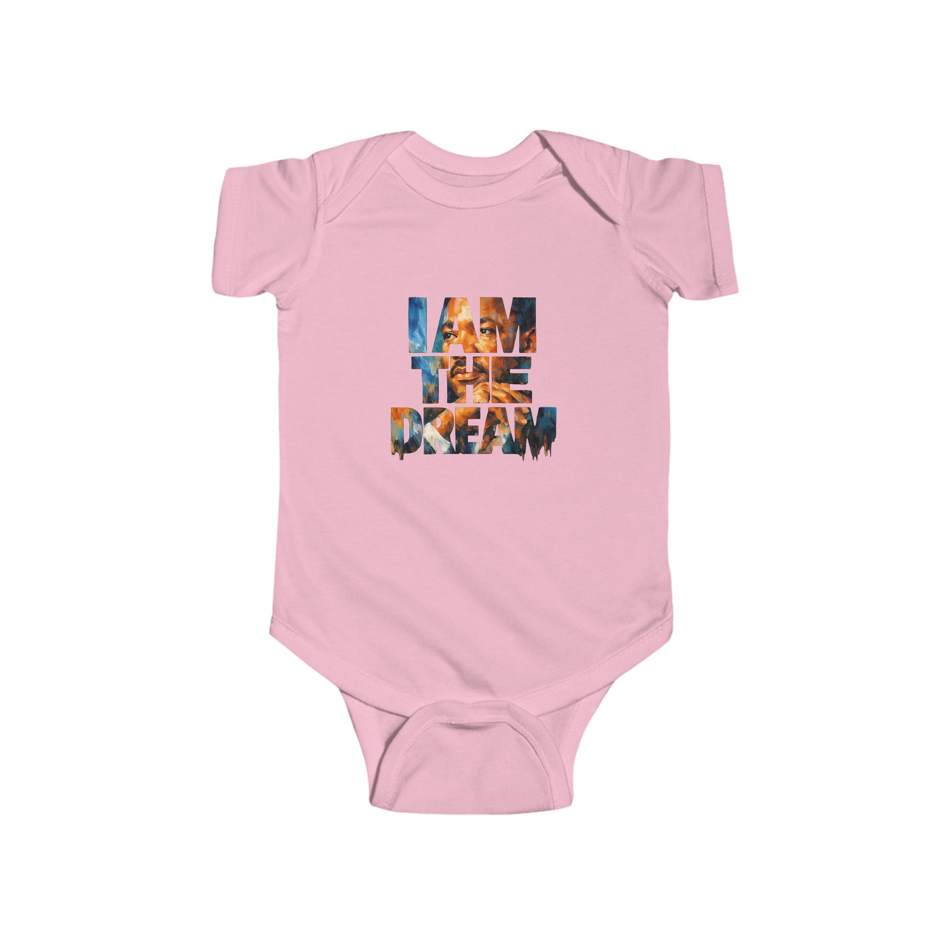 Pink baby onesie with 'I AM THE DREAM' text on a white background