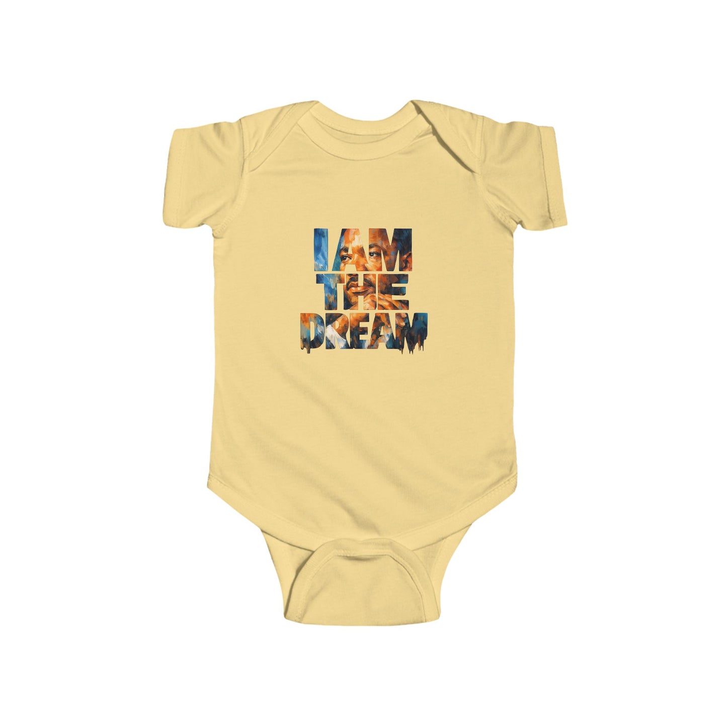 Yellow baby onesie with 'I AM THE DREAM' text on a white background