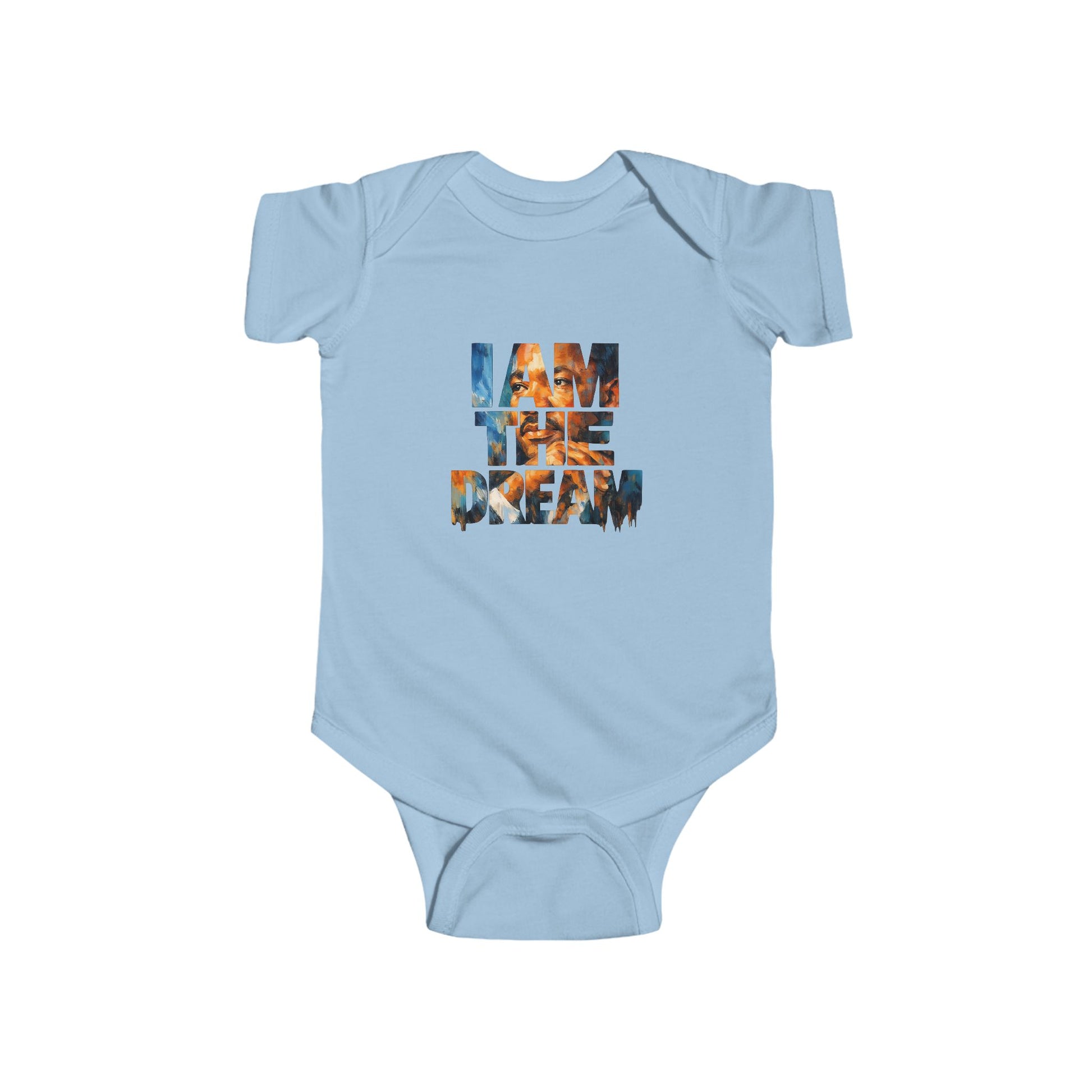 Light blue baby onesie with 'I AM THE DREAM' text on a white background
