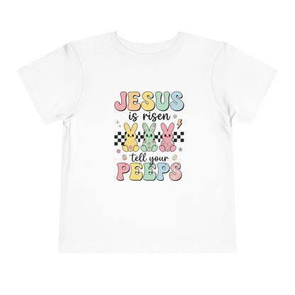 White t-shirt with colorful Easter text and bunny graphics on a white background