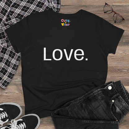 Black t-shirt with 'Love.' text on a wooden surface with casual items.