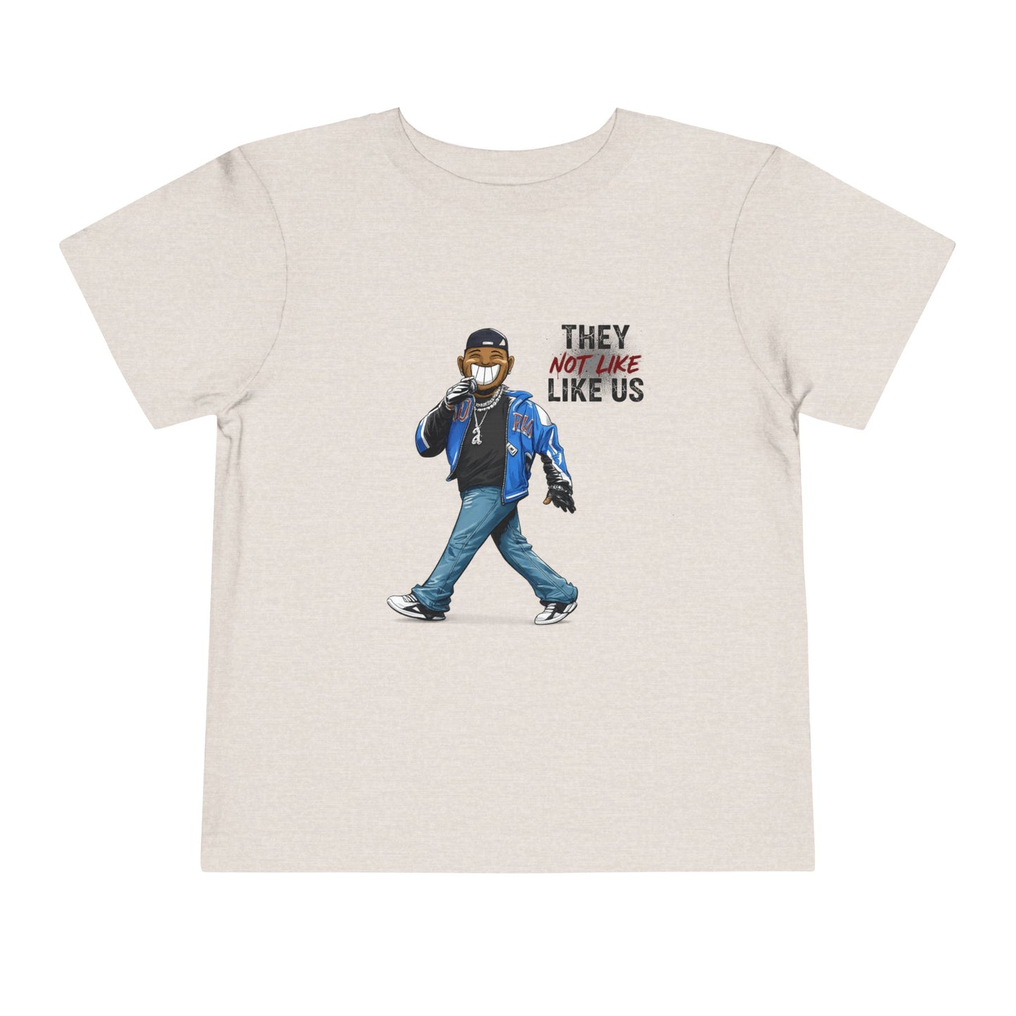 Beige t-shirt with graphic of a person wearing a mask and text 'THEY NOT LIKE US' on a white background