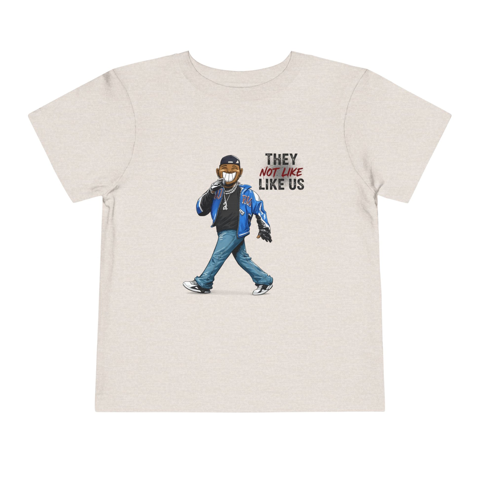 Beige t-shirt with graphic of a person wearing a mask and text 'THEY NOT LIKE US' on a white background