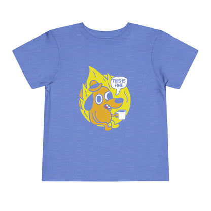 Blue t-shirt with a cartoon dog graphic and 'This is fine' text on a white background
