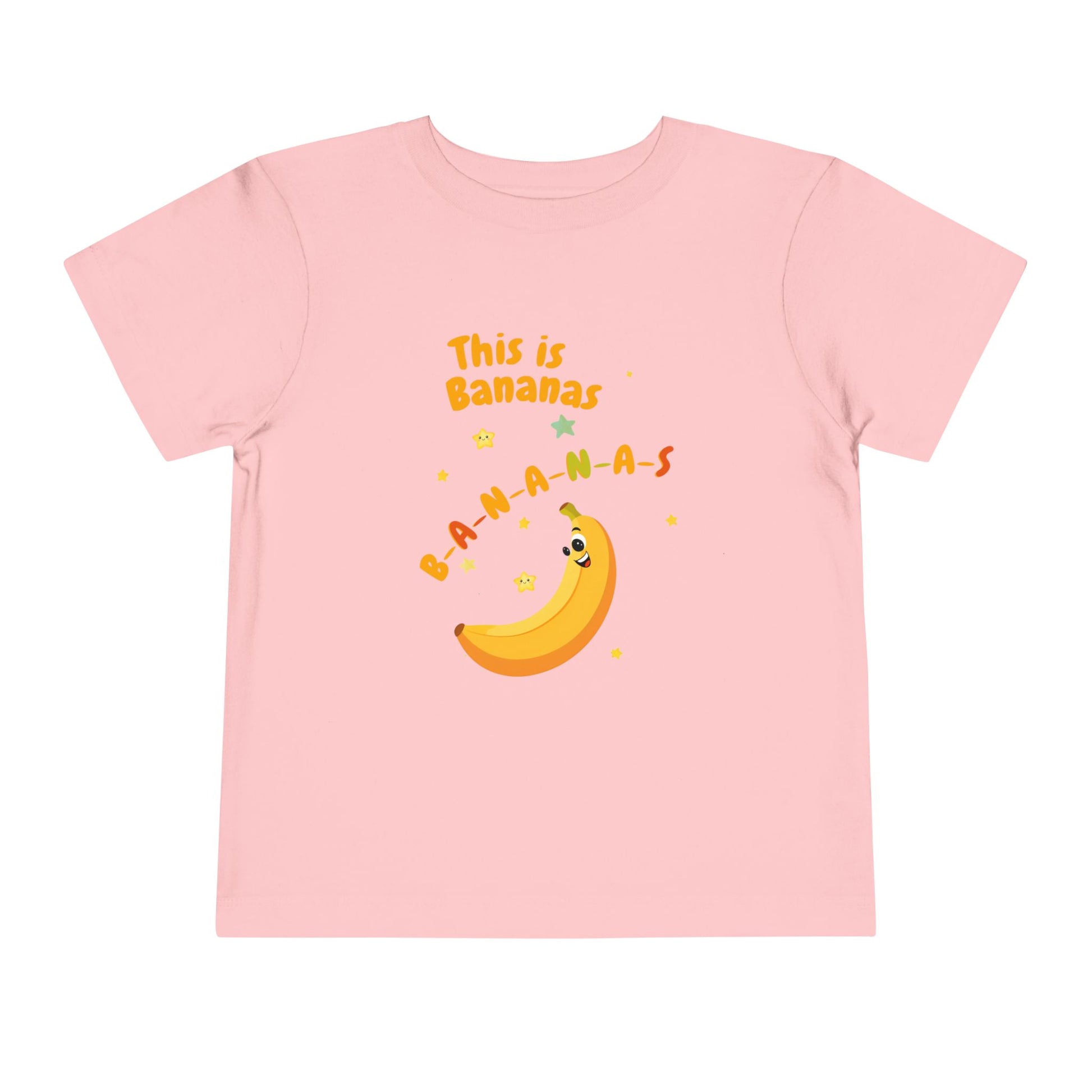 Pink t-shirt with a banana graphic and text on a white background