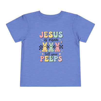 Blue t-shirt with Easter-themed text and graphics on a white background