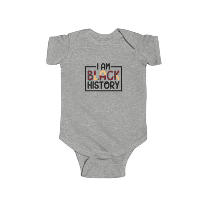 Gray baby onesie with 'I AM BLACK HISTORY' text on a white background
