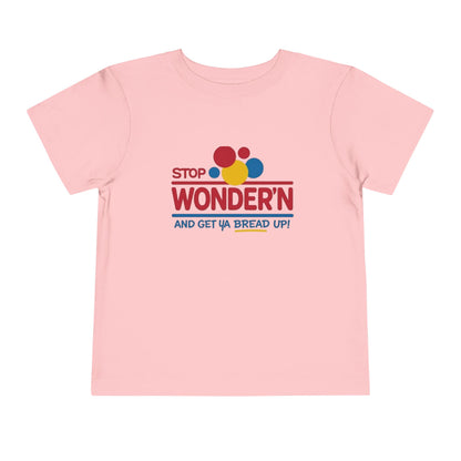 Pink t-shirt with colorful graphic 'stop wondering ' text on a white background