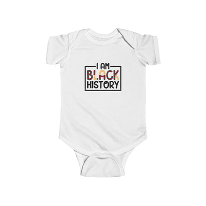 White baby onesie with 'I AM BLACK HISTORY' text on a white background
