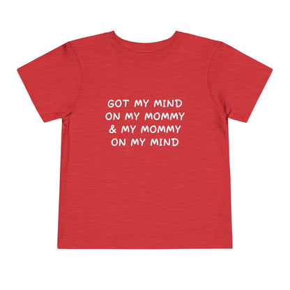 Red t-shirt with white text on a white background