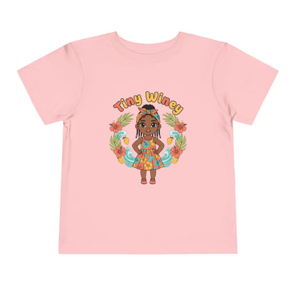 Pink t-shirt with a cartoon character and 'Tiny Winey' text on a white background