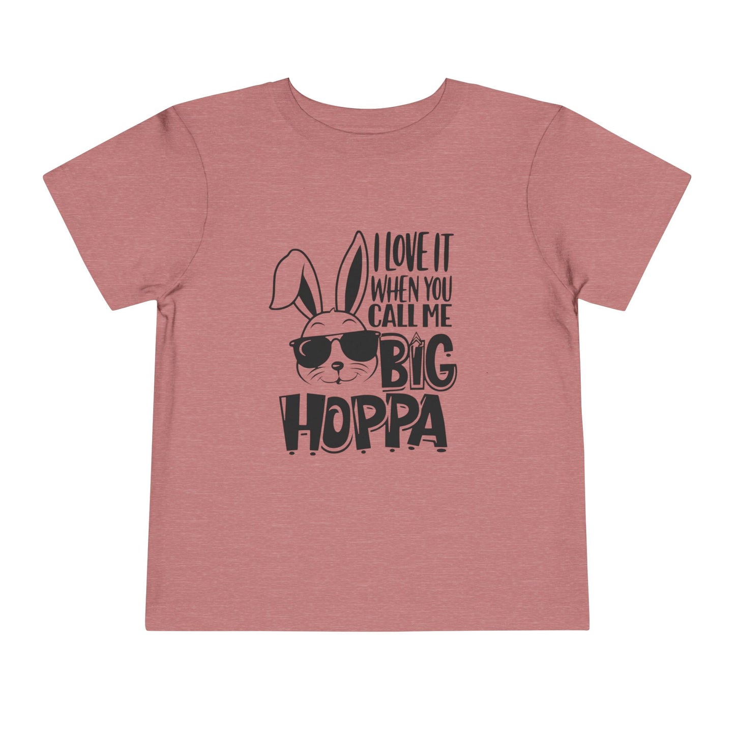 Pink t-shirt with a graphic of a rabbit wearing sunglasses and text on a white background