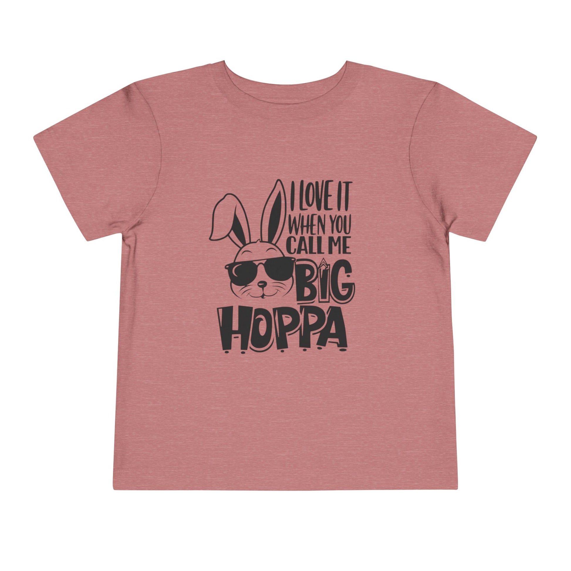 Pink t-shirt with a graphic of a rabbit wearing sunglasses and text on a white background