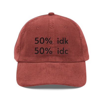 Red cap with black text '50% idk 50% idc' on a white background