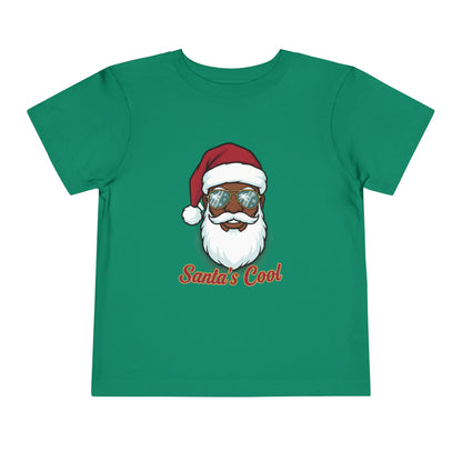 Green t-shirt with a graphic of a Santa Claus-like character wearing sunglasses and the text 'Santa's Cool' on a white background.